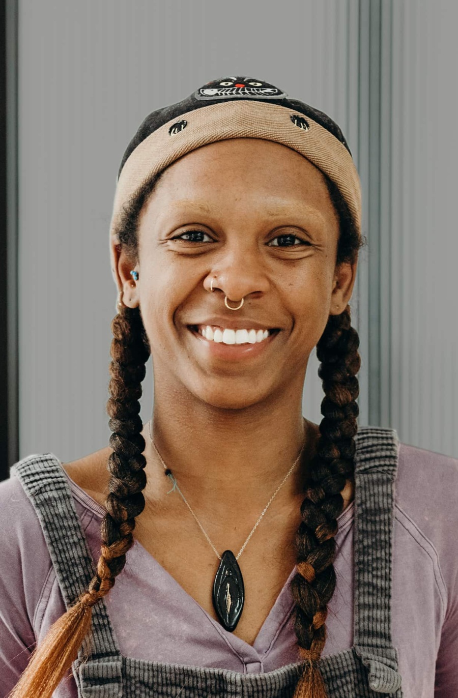 Young woman smiling at the camera.